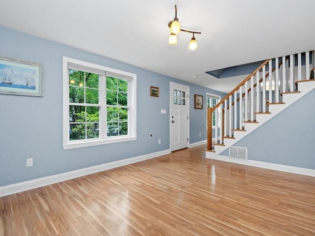 4 University Park, Waltham, MA 02453 - entryway featuring stairs, light wood-style flooring, and baseboards