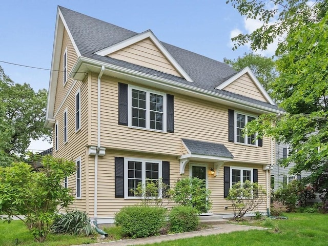 4 University Park, Waltham, MA 02453 - view of front of home with roof with shingles and a front lawn