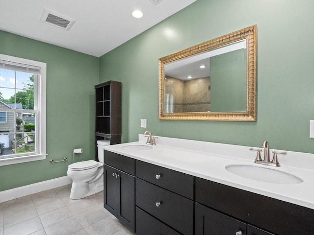 4 University Park, Waltham, MA 02453 - bathroom featuring toilet, double vanity, baseboards, and tiled shower