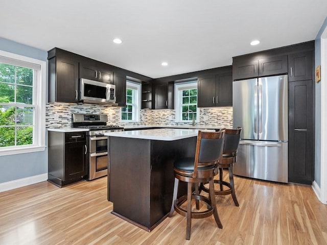 4 University Park, Waltham, MA 02453 - kitchen with stainless steel appliances, light countertops, light wood-style floors, and recessed lighting