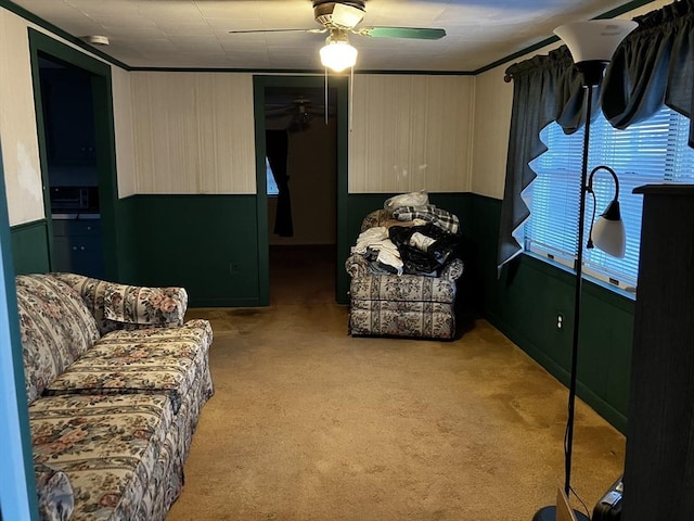 living room featuring light carpet and ceiling fan