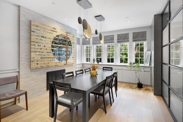 dining space featuring recessed lighting and light wood finished floors