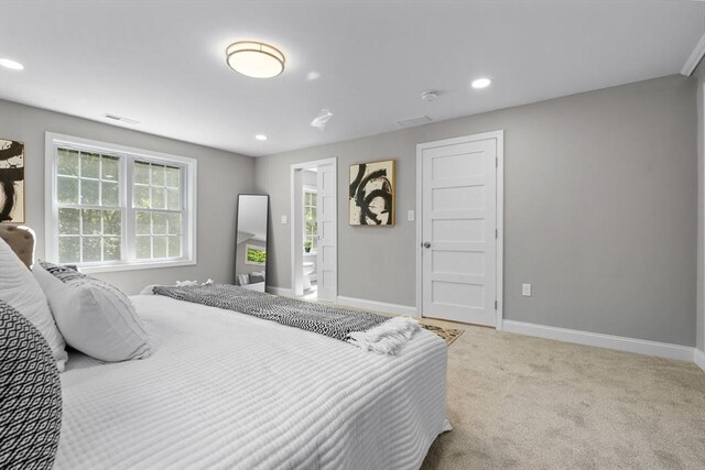 bedroom with light colored carpet