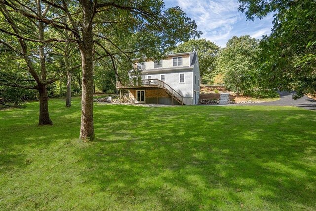 view of yard with a wooden deck