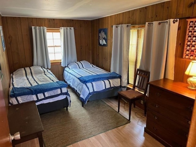 390 Brackett Rd, Eastham, MA 02642 - bedroom featuring light wood-style floors and wooden walls