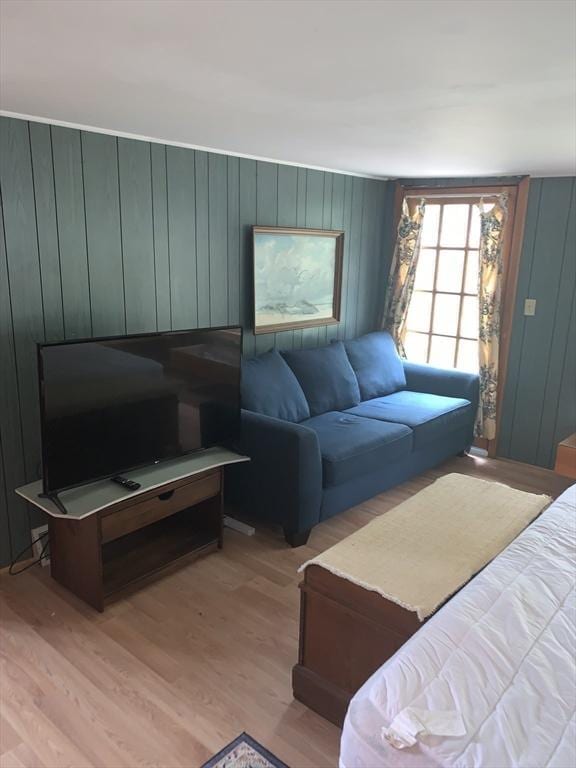 390 Brackett Rd, Eastham, MA 02642 - living room with light wood-style floors and wooden walls