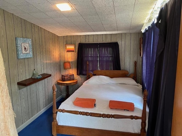 390 Brackett Rd, Eastham, MA 02642 - bedroom featuring wooden walls and baseboards