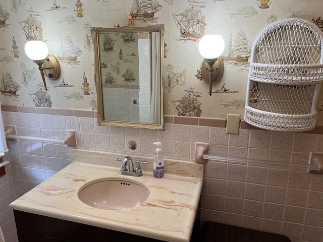 390 Brackett Rd, Eastham, MA 02642 - bathroom with vanity, a shower stall, and tile walls