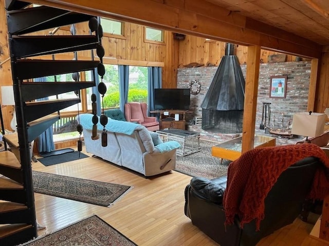 390 Brackett Rd, Eastham, MA 02642 - living room featuring healthy amount of natural light, wooden walls, and wood finished floors