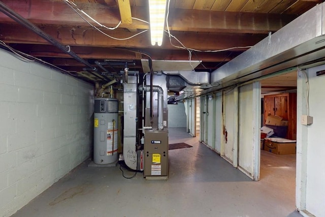 unfinished below grade area featuring water heater and heating unit