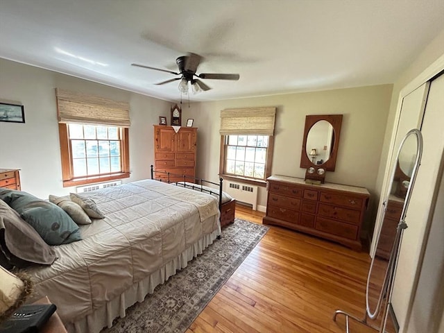 29 Deernolm St, Grafton, MA 01536 - bedroom featuring radiator heating unit, multiple windows, light wood-type flooring, and ceiling fan