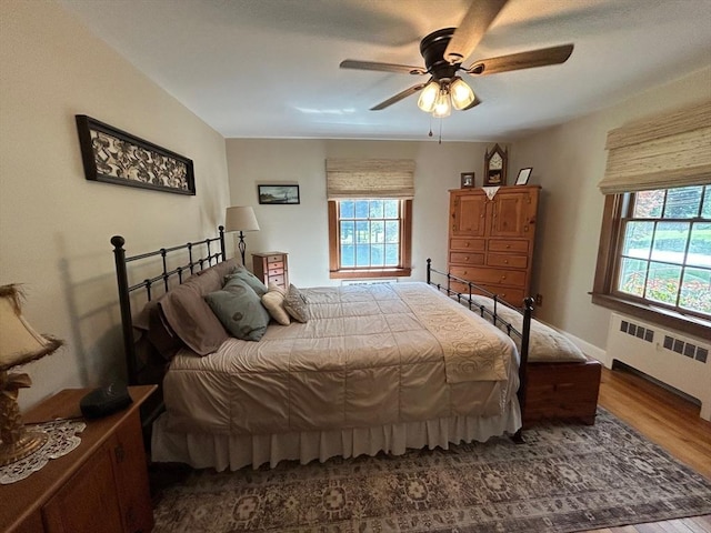 29 Deernolm St, Grafton, MA 01536 - bedroom with radiator, wood finished floors, and a ceiling fan