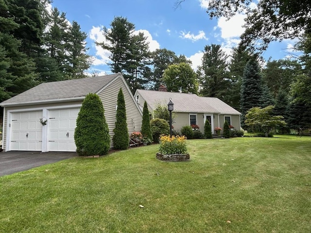 29 Deernolm St, Grafton, MA 01536 - view of front of house with a garage, a front lawn, and a chimney