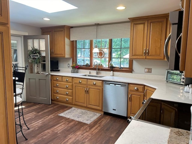 29 Deernolm St, Grafton, MA 01536 - kitchen with stainless steel appliances, a sink, a skylight, dark wood finished floors, and recessed lighting