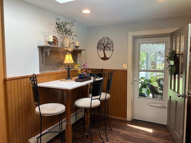 29 Deernolm St, Grafton, MA 01536 - indoor bar with wainscoting, a baseboard heating unit, dark wood-type flooring, wooden walls, and recessed lighting