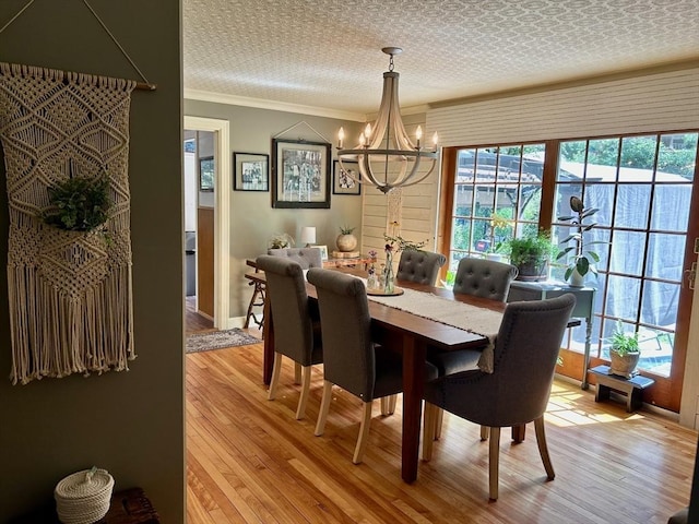 29 Deernolm St, Grafton, MA 01536 - dining space with a chandelier, light wood-style floors, plenty of natural light, and crown molding