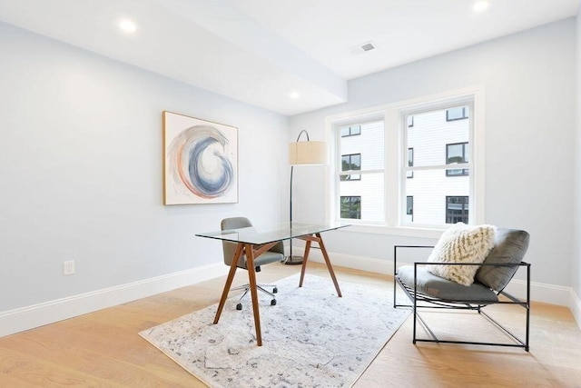 office featuring light wood-type flooring, visible vents, baseboards, and recessed lighting