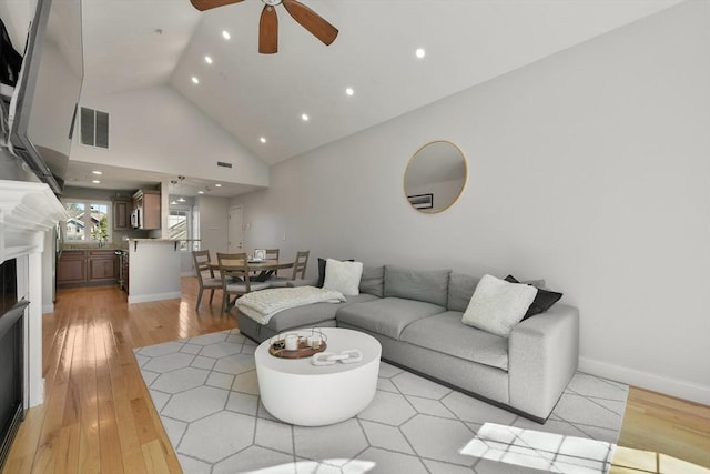 410 Salem St Unit 707, Wakefield, MA 01880 - living room featuring ceiling fan, a fireplace, recessed lighting, light wood-style floors, and high vaulted ceiling