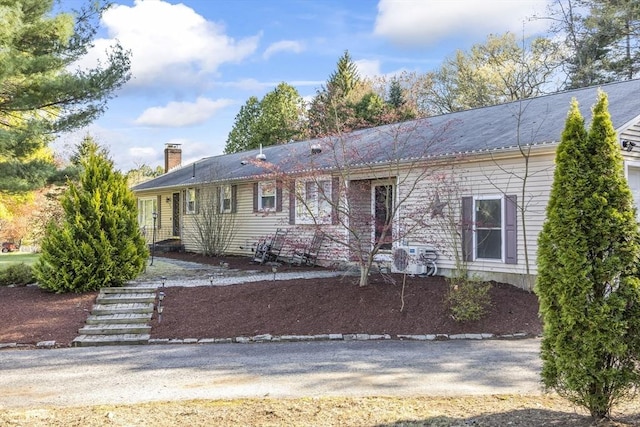 single story home with a chimney