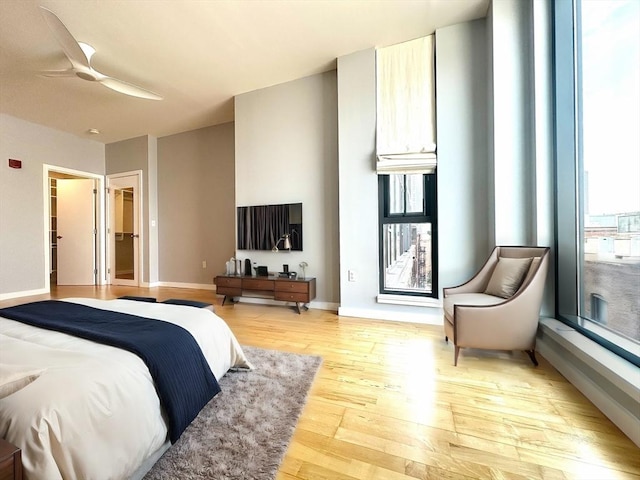 bedroom featuring light hardwood / wood-style flooring and ceiling fan