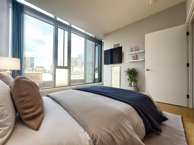 bedroom with wood-type flooring