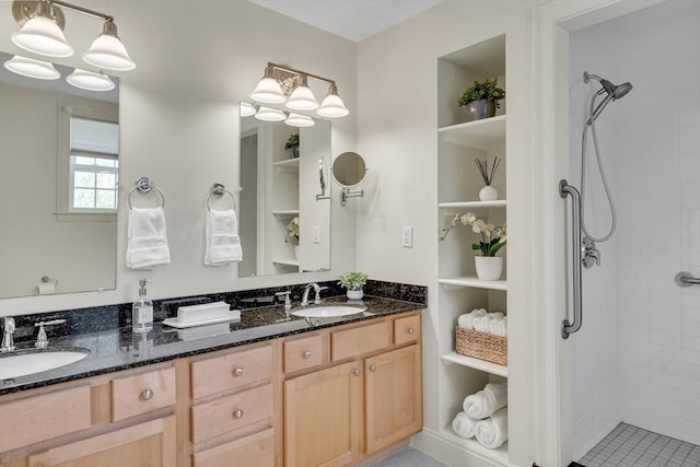 82 Virginia Rd Unit 405, Lincoln, MA 01773 - bathroom with built in shelves, a tile shower, and double vanity