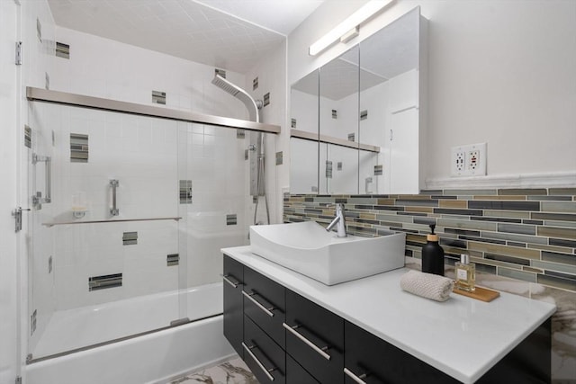 44 Fresh Pond Pl Unit 44, Cambridge, MA 02138 - bathroom featuring vanity, shower / bath combination with glass door, marble finish floors, and tasteful backsplash