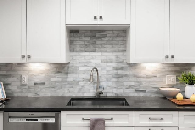 44 Fresh Pond Pl Unit 44, Cambridge, MA 02138 - kitchen featuring stainless steel dishwasher, a sink, decorative backsplash, and white cabinetry