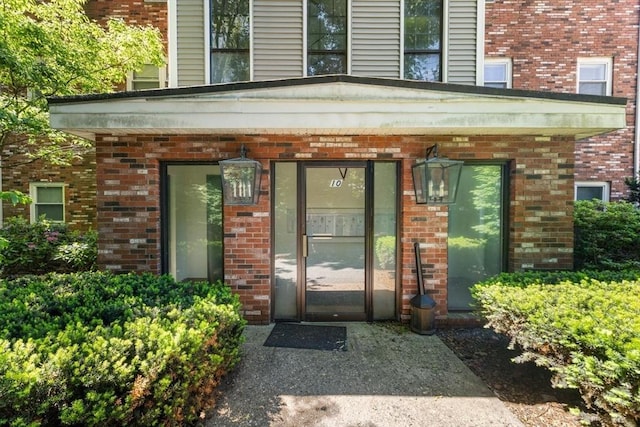 10 Beacon St Unit 105, Woburn, MA 01801 - doorway to property with brick siding