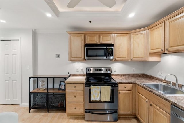 10 Beacon St Unit 105, Woburn, MA 01801 - kitchen featuring appliances with stainless steel finishes, light brown cabinets, a sink, light wood-type flooring, and recessed lighting