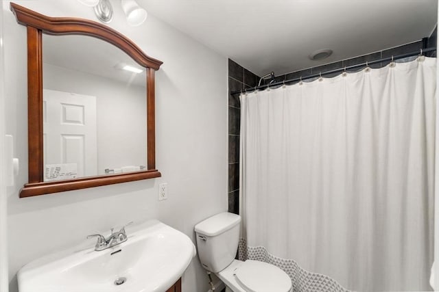 10 Beacon St Unit 105, Woburn, MA 01801 - full bath featuring a sink, toilet, and a shower with curtain