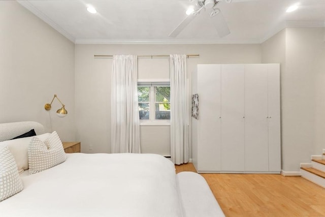 10 Beacon St Unit 105, Woburn, MA 01801 - bedroom with crown molding, light wood-type flooring, recessed lighting, and a ceiling fan