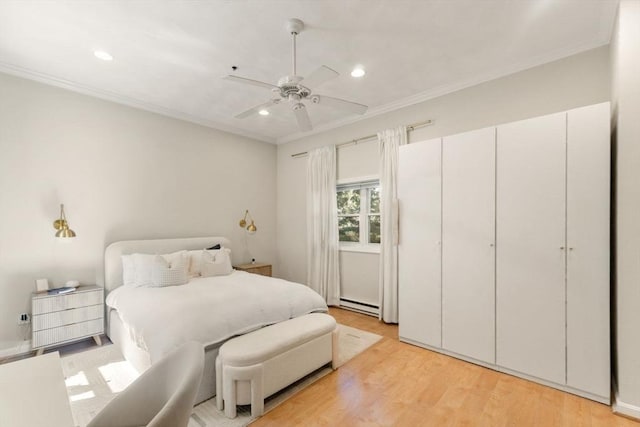 10 Beacon St Unit 105, Woburn, MA 01801 - bedroom featuring baseboard heating, crown molding, light wood-style flooring, recessed lighting, and a ceiling fan