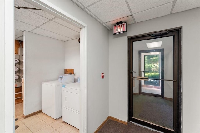 10 Beacon St Unit 105, Woburn, MA 01801 - washroom featuring washing machine and clothes dryer and baseboards
