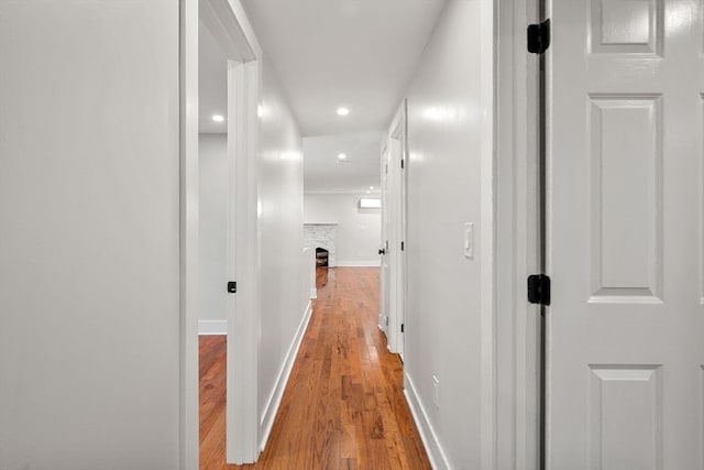 corridor featuring light hardwood / wood-style floors