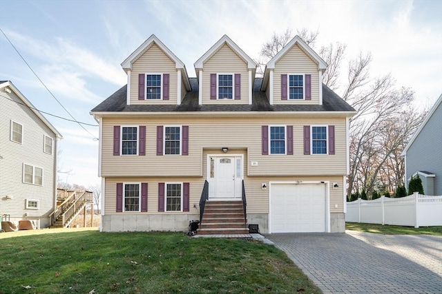 view of front facade with a garage and a front lawn