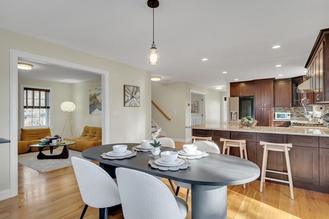 dining room featuring light hardwood / wood-style floors