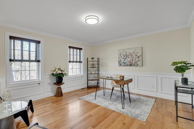 office with ornamental molding and light hardwood / wood-style floors