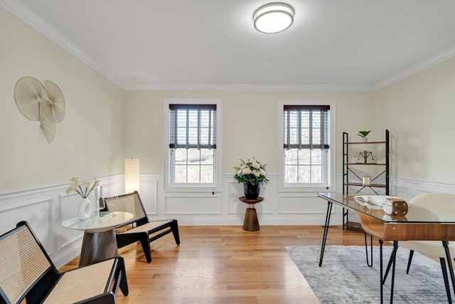 office space with light hardwood / wood-style flooring and ornamental molding