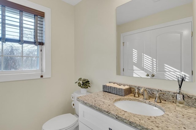 bathroom with vanity and toilet