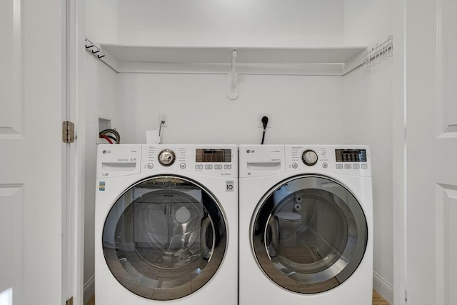 laundry room with washer and dryer