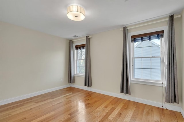 unfurnished room featuring light hardwood / wood-style floors