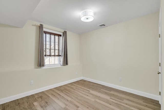 unfurnished room featuring light wood-type flooring