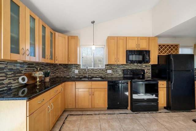 kitchen with decorative backsplash, lofted ceiling, a sink, light tile patterned floors, and black appliances