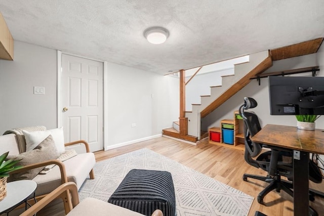 office with baseboards and light wood finished floors
