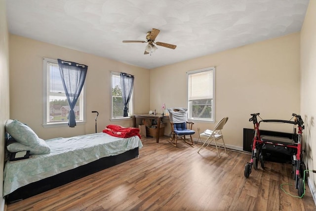1438 Somerset Ave, Taunton, MA 02780 - bedroom featuring wood finished floors, a ceiling fan, and baseboards