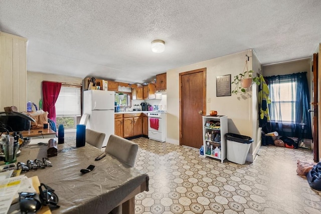 1438 Somerset Ave, Taunton, MA 02780 - dining space featuring a textured ceiling and light floors