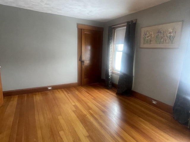 spare room featuring hardwood / wood-style flooring