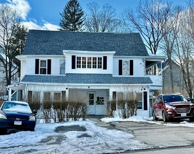 view of front of property with roof with shingles