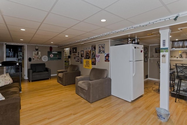 83 Chalmers St, Springfield, MA 01118 - living area with light wood-type flooring, a drop ceiling, recessed lighting, and ornate columns